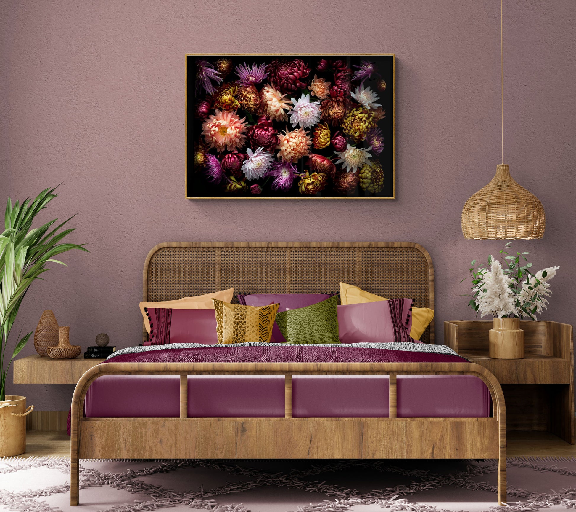 Landscape format dark botanical print of multi-coloured heritage Chrysanthemums photographed on a black background hung over a double sized bed