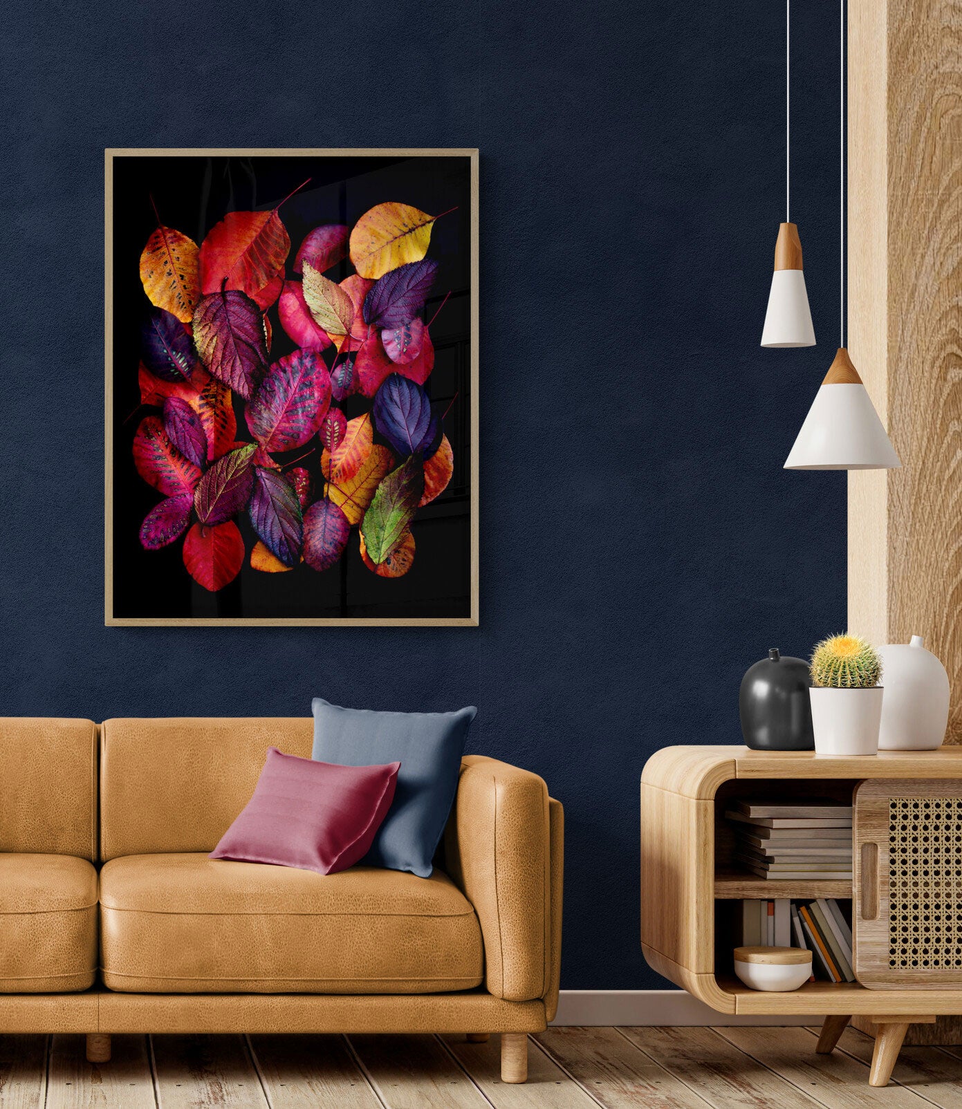 Dark botanical photographic print, featuring Cotinus and Viburnum leave in autumn colours on a black background., framed and placed on a teal coloured wall.