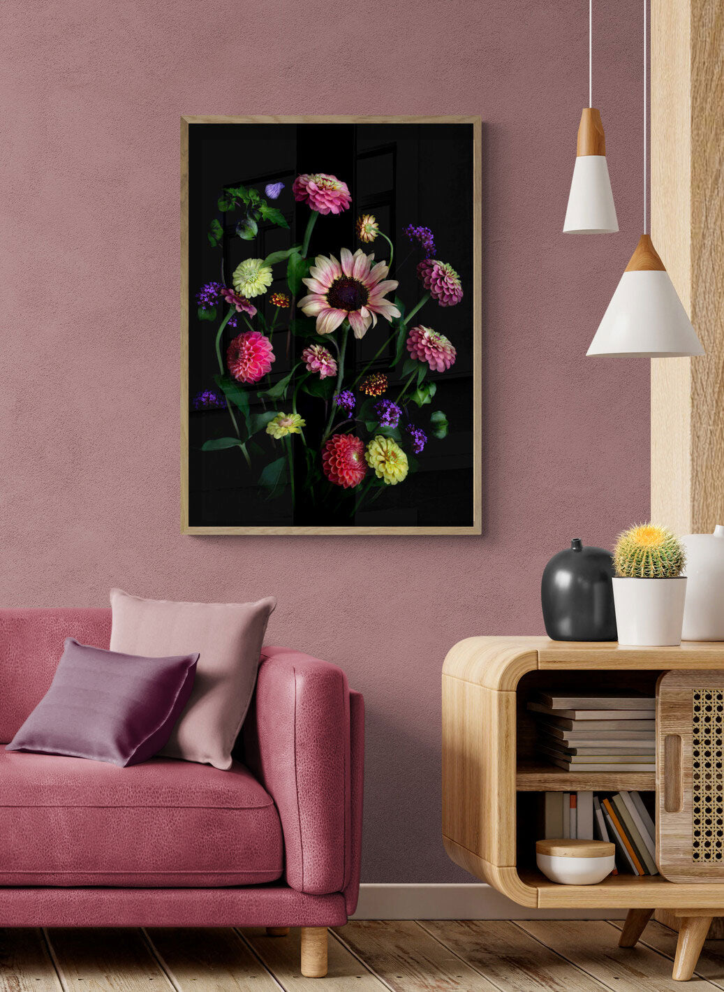 A botanical print featuring a Sunflower with Zinnias, Dahlias, Verbena and a touch of the Shoo Fly plant, Nicandra physalodes., framed on a peach coloured wall.