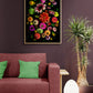 Colorful flower arrangement of Zinnia, Sunflower and Dahlias on a black background, framed and hanging on a wall behind a sofa