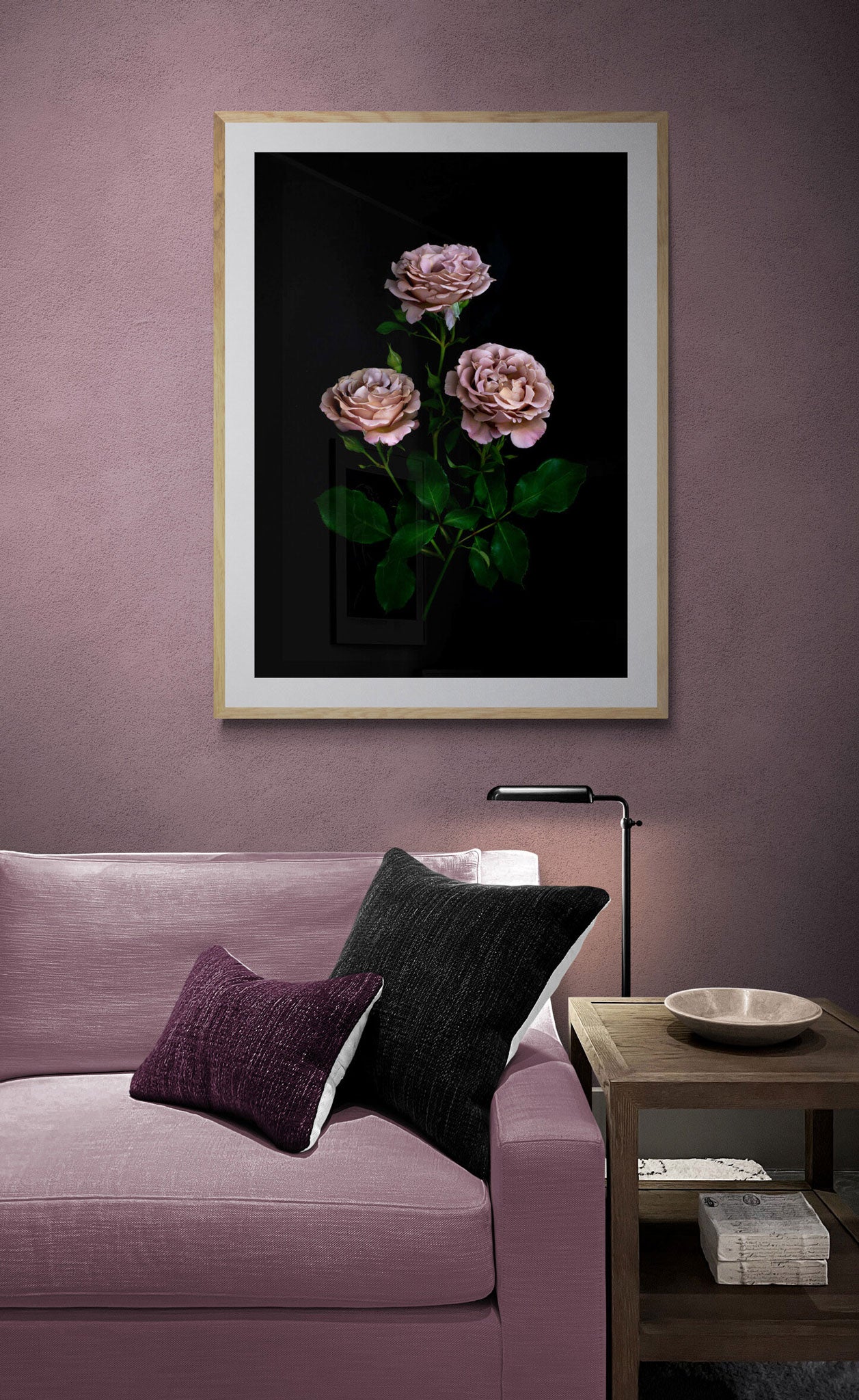 Dark botanical photographic print, featuring Rosa 'Koko Loco' on a black background., framed on a dusky pink wall.