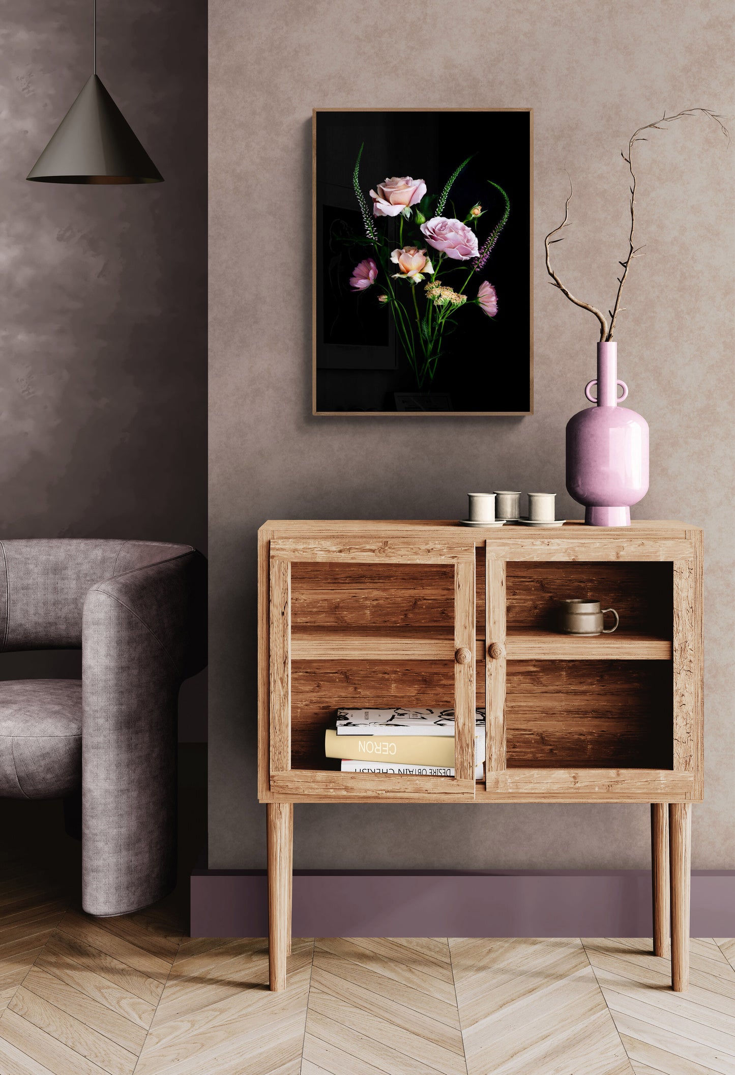 A posy of Koko Loco roses, Achillea, Cosmos and Veronica photographed on a black background and framed and hung on a taupe-coloured wall.