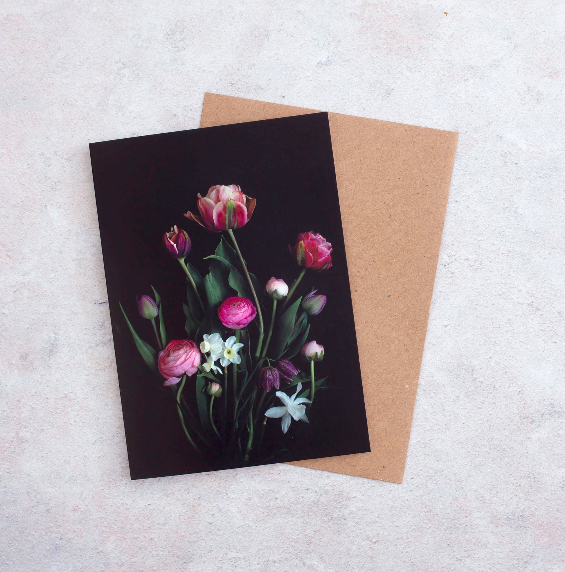 Botanical greeting card with Tulips, Ranunculus and Narcissi on a black background