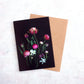 Botanical print greeting cards of Tulips , Narcissi and Ranunculus on a black background.
