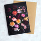 Botanical greeting card with mixed color Roses on a dark background.