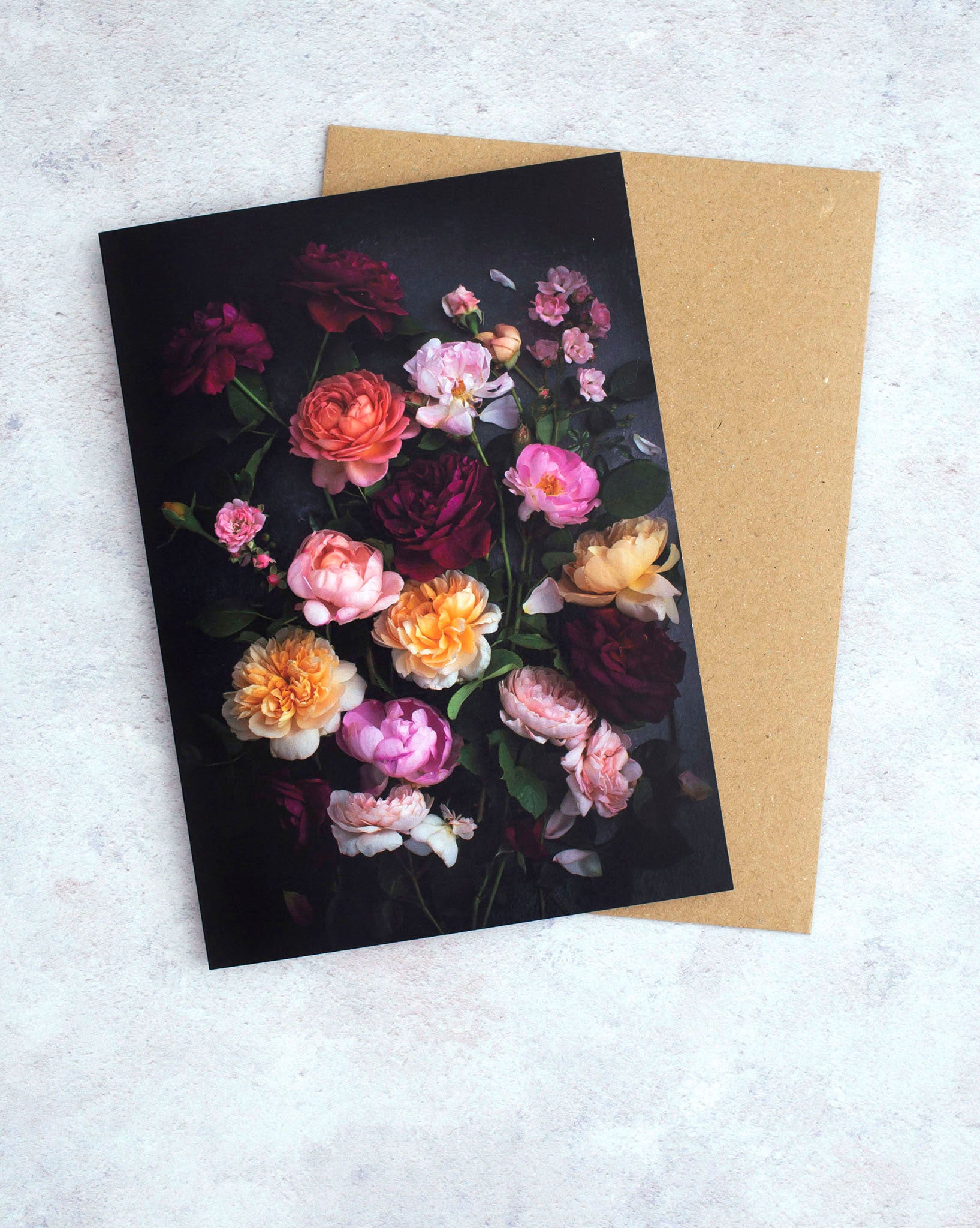 Botanical greeting card with mixed color Roses on a dark background.