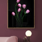 Botanical print of Pink Tulips on a black background, framed on a dark wall.
