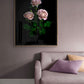 Dark botanical photographic print, featuring Rosa 'Koko Loco' on a black background., framed on a dusky pink wall.