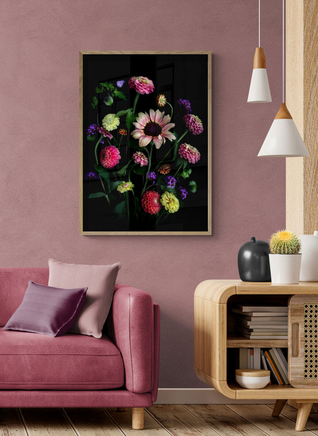 A botanical print featuring a Sunflower with Zinnias, Dahlias, Verbena and a touch of the Shoo Fly plant, Nicandra physalodes., framed on a peach coloured  wall.